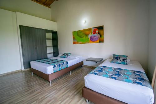 Postel nebo postele na pokoji v ubytování Hotel Campestre LA ALDEA