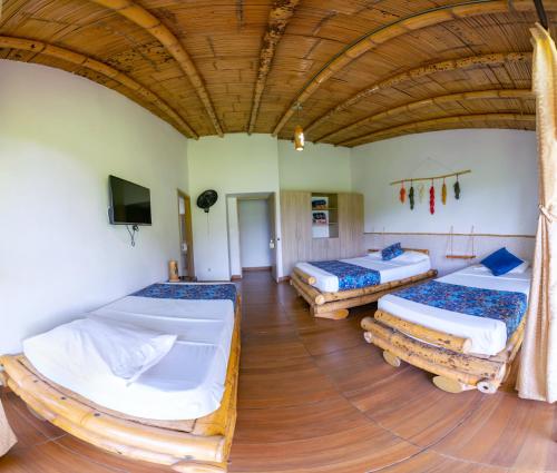 Postel nebo postele na pokoji v ubytování Hotel Campestre LA ALDEA