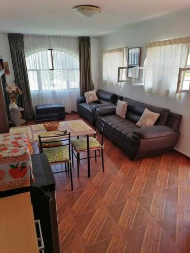a living room with a couch and a table at SAN PAOLY. in Trujillo