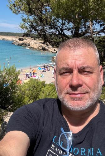 a man standing in front of a beach at Room near Nice Port in a shared apartment in Nice