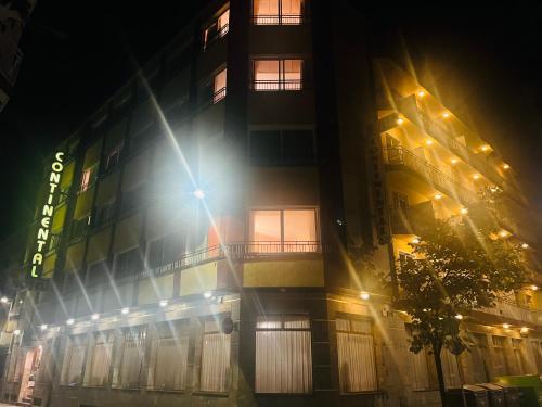 a building at night with the light shining on it at HOTEL CONTINENTAL in Calella