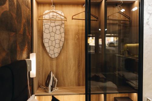 a bathroom with a mirror and a phone on a wall at Apartman Premijer 2 in Čukarica