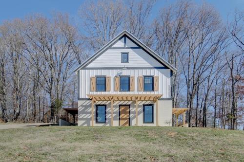 a white house on top of a hill at Luxury Barndo 2AS EuropeStyle Farm Stay Fresh Eggs in Jefferson City