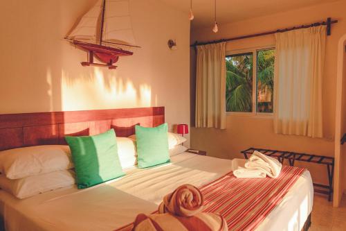 Postel nebo postele na pokoji v ubytování Hotel Puerto Holbox Beach Front