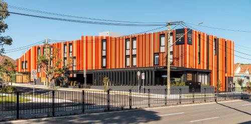an orange building on the side of a street at Haberfield Hotel in Sydney
