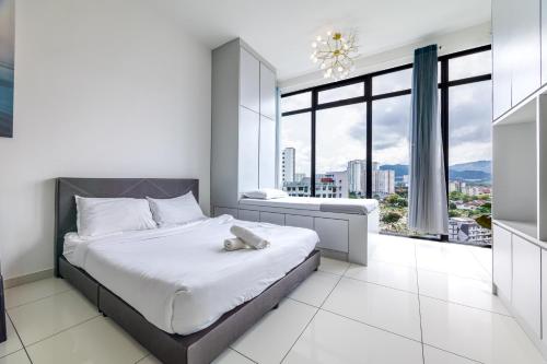 a white bedroom with a bed and a large window at #12Georgetown Luxury Suite with Rooftop Pool in George Town