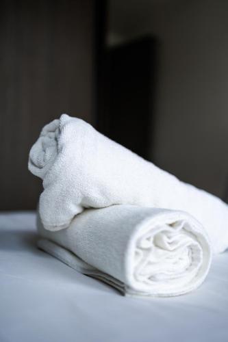 a towel with a stuffed elephant on a table at #12Georgetown Luxury Suite with Rooftop Pool in George Town