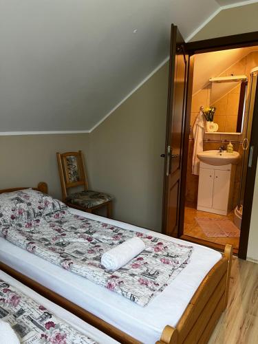 Postel nebo postele na pokoji v ubytování Kondákor Vendégház