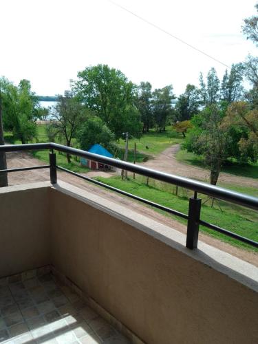 a balcony with a view of a train track at Rivera Este in Colón