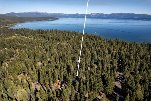an aerial view of a bunch of trees and water at Modern Retro Tahoe Chic Chalet in Tahoe City