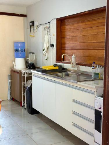 a kitchen with a sink and a counter at Casa do Pescador - Praia do Maceió - Camocim - CE in Camocim