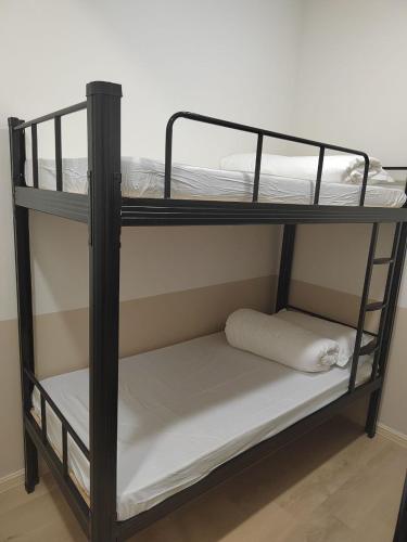 two bunk beds in a room with at LumaNest Senawang in Seremban