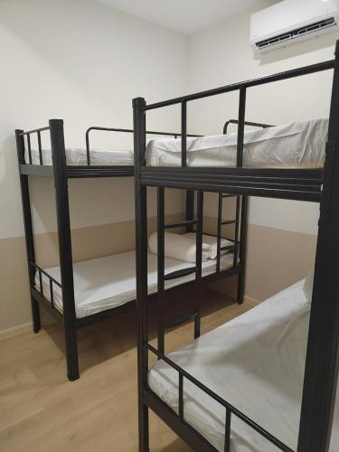 a couple of bunk beds in a room at LumaNest Senawang in Seremban
