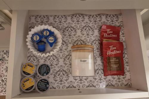 a shelf with a jar of food and other items at Country Retreat Horseshoe Valley in Shanty Bay