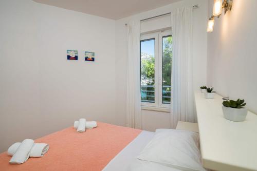 Кровать или кровати в номере Apartments Katica