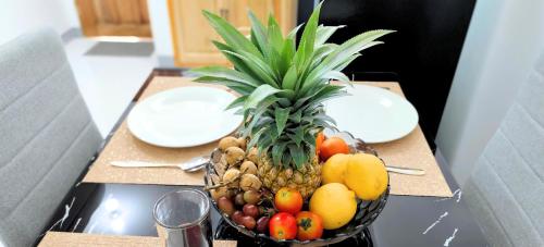 a bowl of fruit sitting on top of a table at Ormoc City Gate 4 in Batog