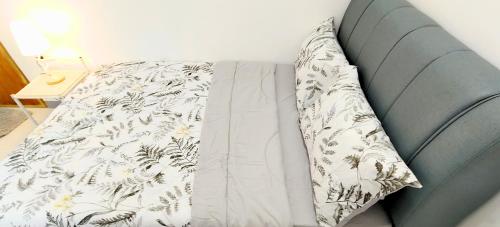 a pillow sitting on a couch in a room at Ormoc City Gate 4 in Batog