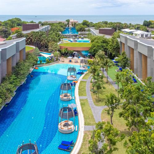 an aerial view of the pool at the resort at Avani+ Hua Hin Resort in Cha Am
