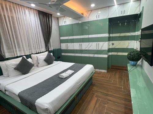 a bedroom with a large bed in a room at Wild Wings Premium Hotel in Hyderabad