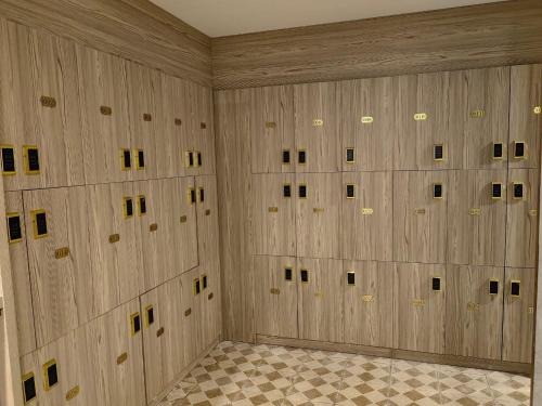 a room with wood paneled walls in a gym at PACI Hotel&SPA in Sihanoukville