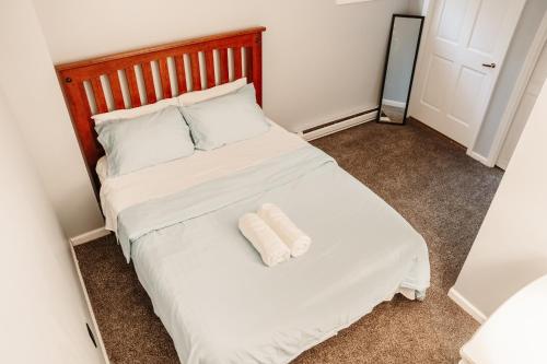 a bedroom with a bed with two pillows on it at Hunter Haven - Luxury Cabin Near Mountain Ski Resort in Lanesville