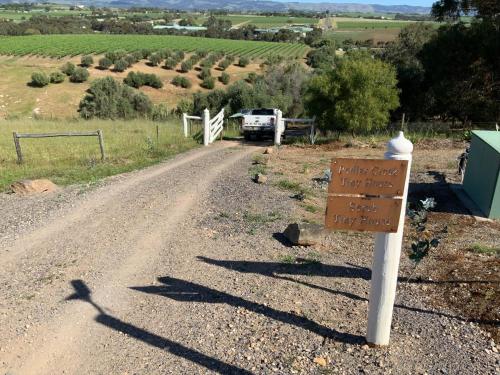 a sign on the side of a dirt road at Pedlar Creek Tiny House by Tiny Away in McLaren Vale