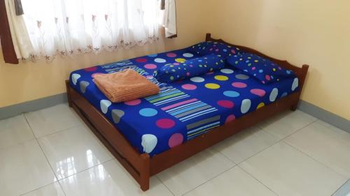 Кровать или кровати в номере Bumi Abah Homestay