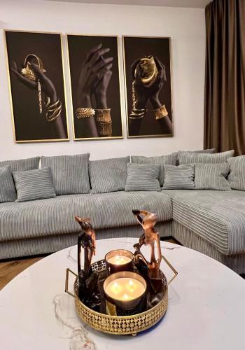 a living room with a couch and a table at Newly Renovated 1BR in Kaunas Downtown Central Location Fast WiFi in Kaunas