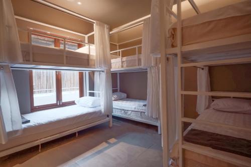 Postel nebo postele na pokoji v ubytování C Lanta Hostel - Adult Only