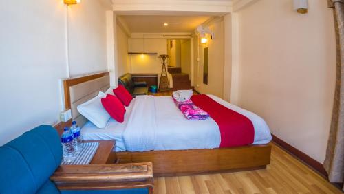 Postel nebo postele na pokoji v ubytování Durbar Guest House