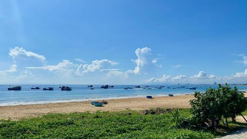 a group of boats in the water on a beach at Sea For Rest Homestay in Xuân Dục
