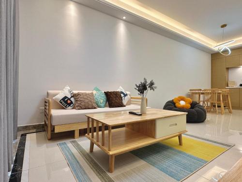 a living room with a couch and a coffee table at Seaview Cozy Room R&F Princess Cove Johor Bahru by YIJIA in Johor Bahru