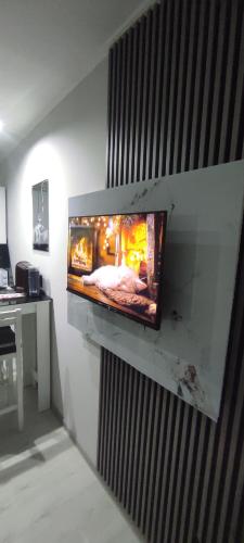 a fireplace on a wall in a room at Spa intimo Višegrad in Višegrad