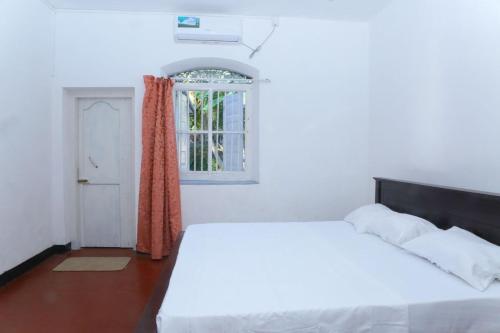 Ένα ή περισσότερα κρεβάτια σε δωμάτιο στο Shire Heaven Villa