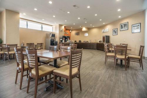 a dining room with a table and chairs at Sleep Inn & Suites And Conference Center Downtown in Indianapolis