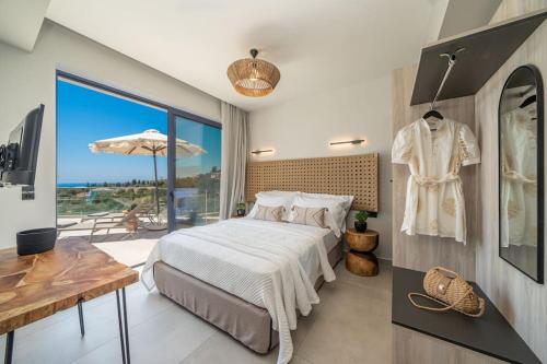 a bedroom with a bed and a large window at Luxury Villa Gjovana's 2 in Svoronata