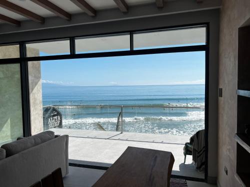 a living room with a view of the ocean at Corazon De Baler in Baler