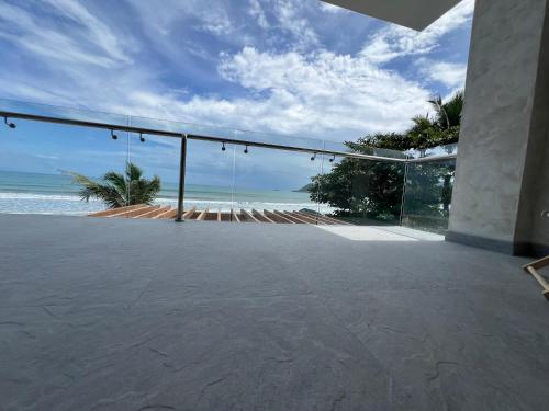 an open patio with a view of the ocean at Corazon De Baler in Baler