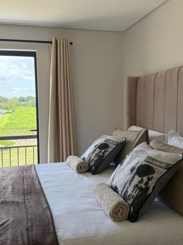 Postel nebo postele na pokoji v ubytování Umhlanga Millenial Deluxe