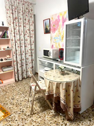 a room with a table with a tv on top at Alojamiento Ruizo in Lorca