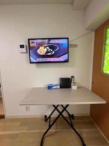 Akazu-hostel newにあるテレビまたはエンターテインメントセンター