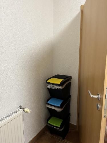 a room with a stack of bins in a room at Gemütliche Einliegerwohnung in Imsbach