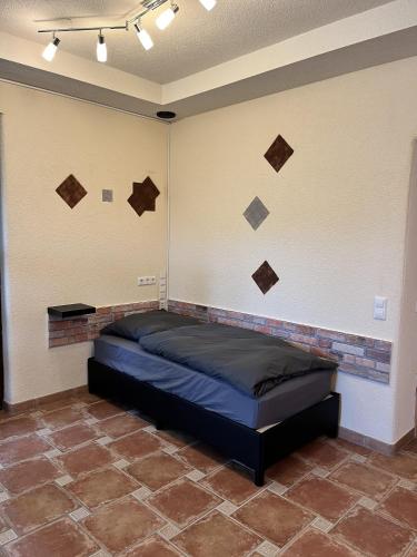 a bedroom with a bed in a room at Gemütliche Einliegerwohnung in Imsbach