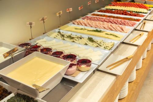 a buffet with many different types of food on display at Acta Sant Just in Sant Just Desvern