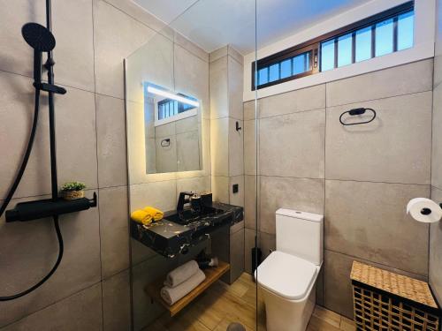 a bathroom with a toilet and a sink at PaulMarie Olympia Studio in Playa de las Americas