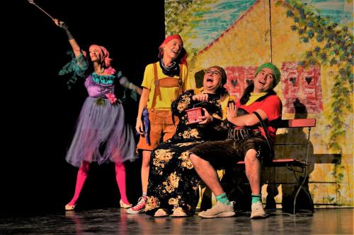 a group of women performing a play on a stage at Seeliebe, 300 Meter zum Wasser, mit Terrasse und Garten in Lembruch