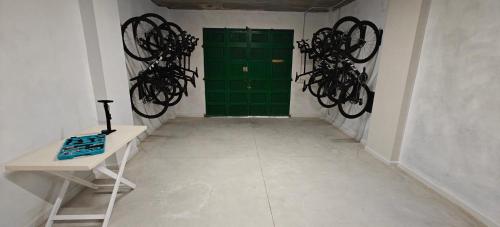 a room with a green door and a white floor at Albercutx Pollentia 1 2 3 in Port de Pollensa