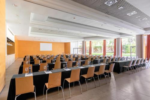a conference room with a long table and chairs at Acta Sant Just in Sant Just Desvern