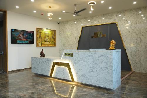 a museum exhibit with a marble counter and a chair at Hotel Amrut Inn Hospitalities in Somnath