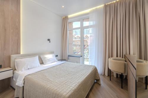 Giường trong phòng chung tại Petrovdom 02-76B Luxury Living in RC Pechersk Plaza, Mykhaila Boichuka 19-А
